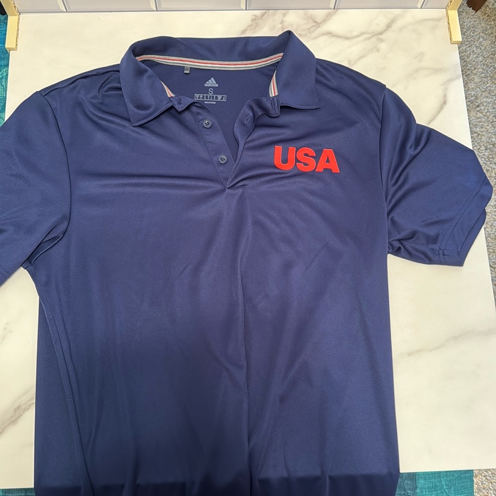 Adidas Team USA Golf polo. Navy with red USA lettering. Size small.